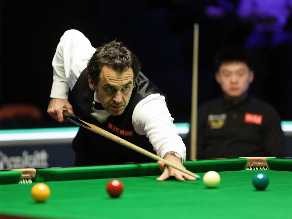 斯诺克世锦赛半决赛首阶段 赵心童与奥沙利文激战成4-4平局 作为斯诺克历史上最伟大的球员之一,罗尼·